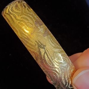 Vintage goldtone animal print embossed bangle bracelet